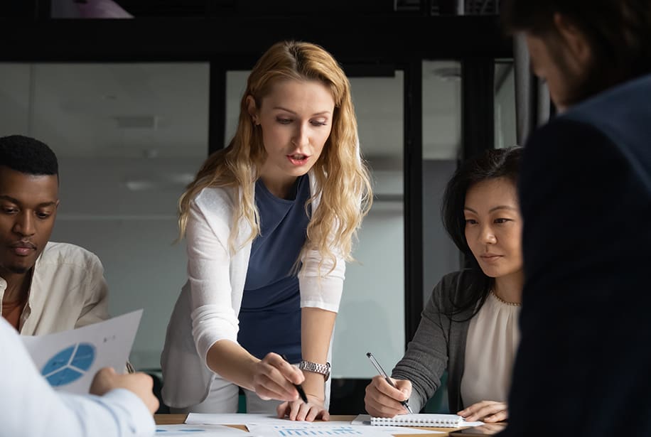 Business meeting, woman presenting data.