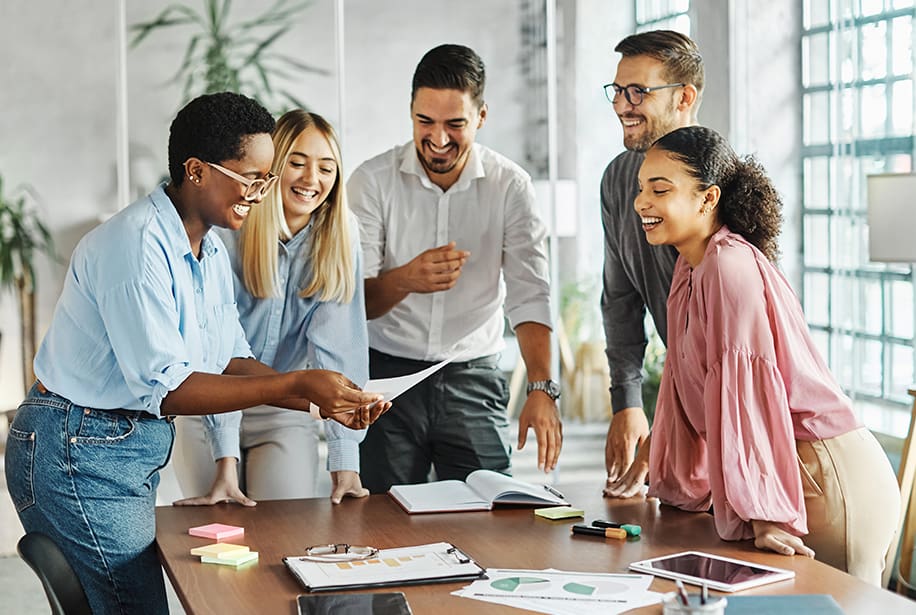 Teamwork and laughter in the office.